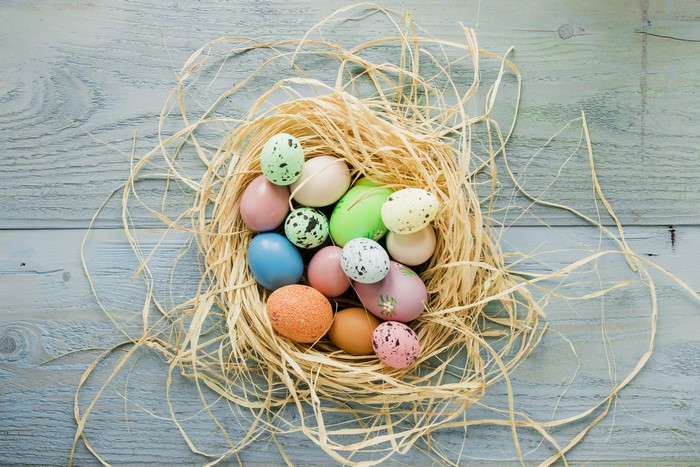Easter eggs in a nest on wood planks