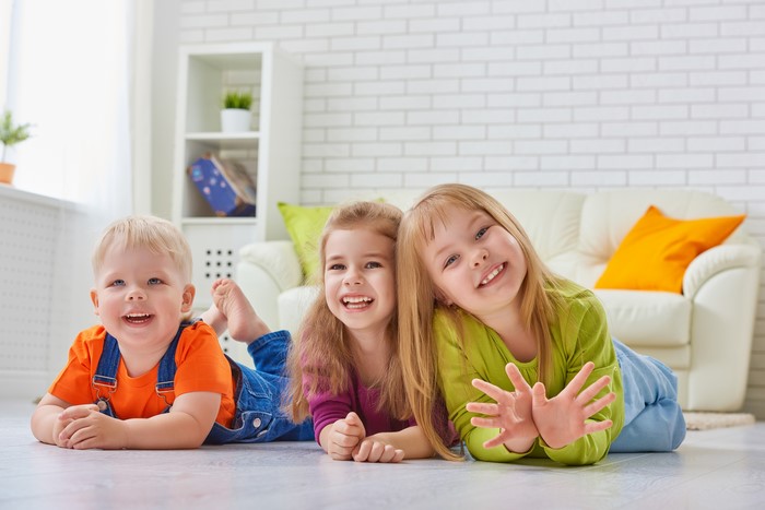 Three Children Lying on Floor