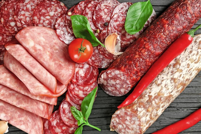 Assortment of Sliced Sausages and Meats with Tomato and Chili