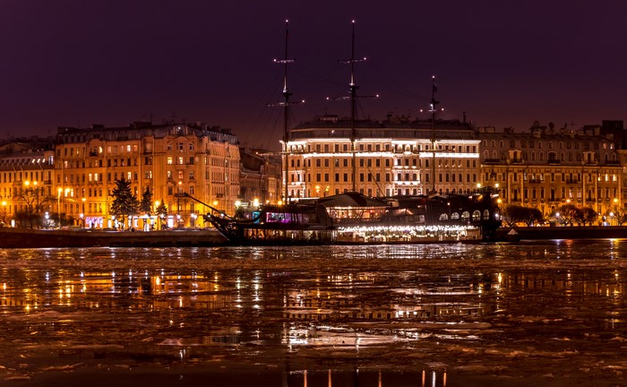 Night view of St. Petersburg embankment with a ship