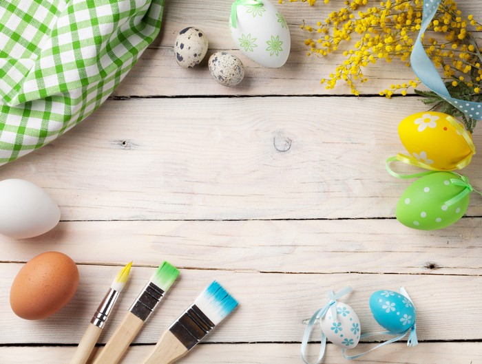 Easter Eggs and Paintbrushes on Wood