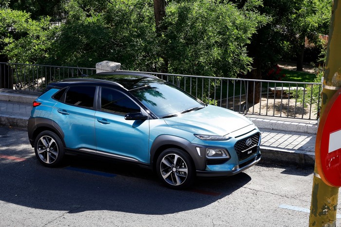 Light blue Hyundai Kona parked on a street