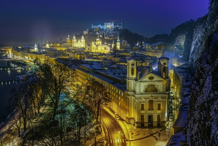 Salzburg, Austria at night in winter with snow