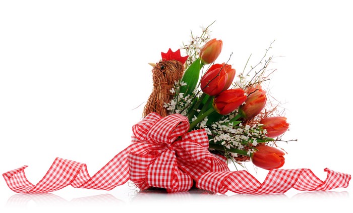 Easter bouquet of tulips with a chicken decoration and ribbon