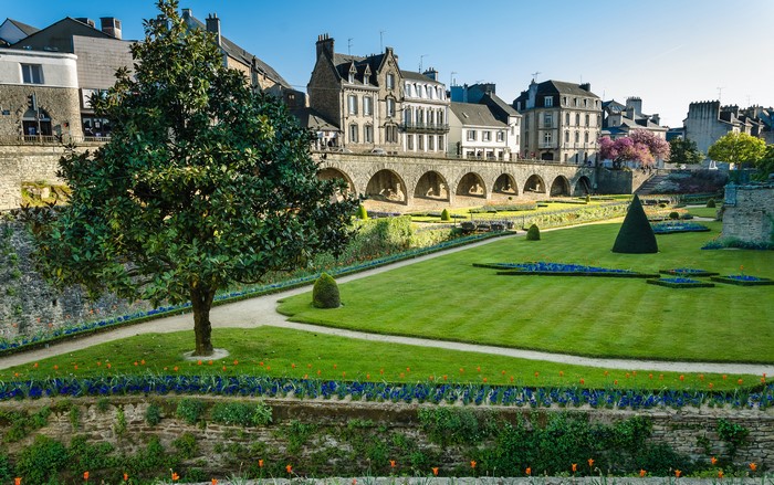 Vannes, Brittany, France: Park with arched bridge and buildings