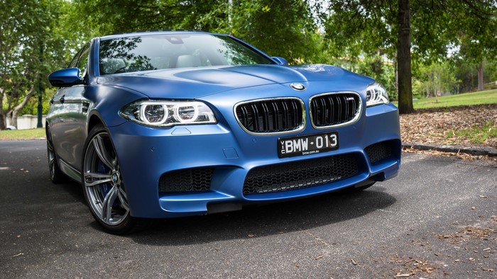 Blue BMW M5 F10 Sedan parked outdoors
