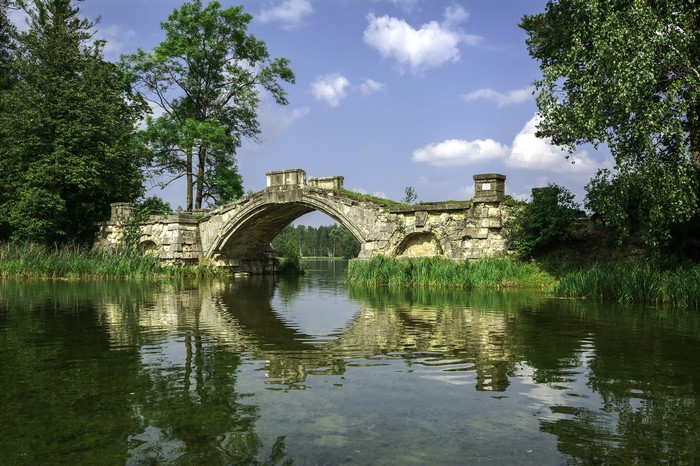 Stone bridge over a river in Leningrad Oblast, Russia