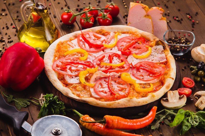 Pizza with Tomatoes and Peppers, Spices, and Ham