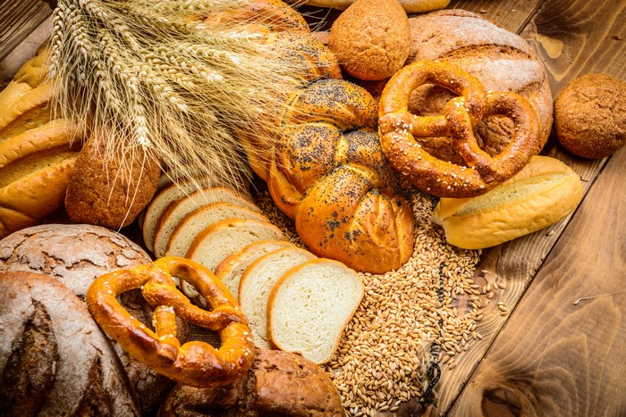 Assortment of Bread, Pastries, and Wheat Stalks