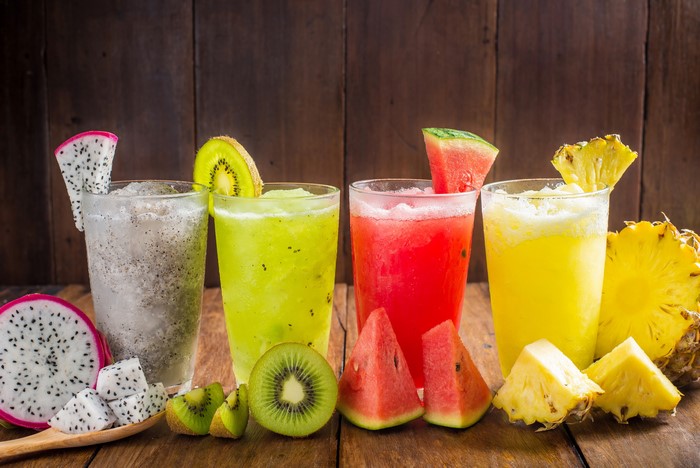 Colorful Fresh Fruit Juices in Glasses 4K