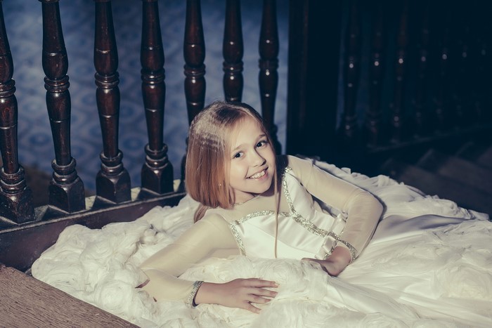 Little girl in a dress smiling