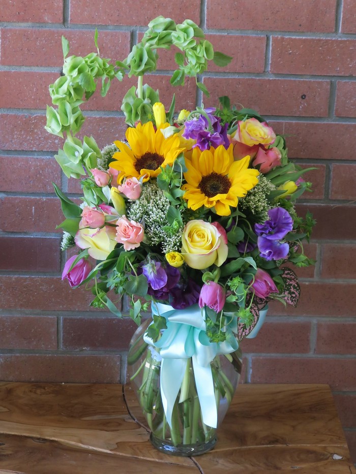Bouquet of Roses and Sunflowers in a Vase