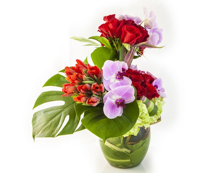 Red Roses, Tulips, and Orchids in a Glass Vase