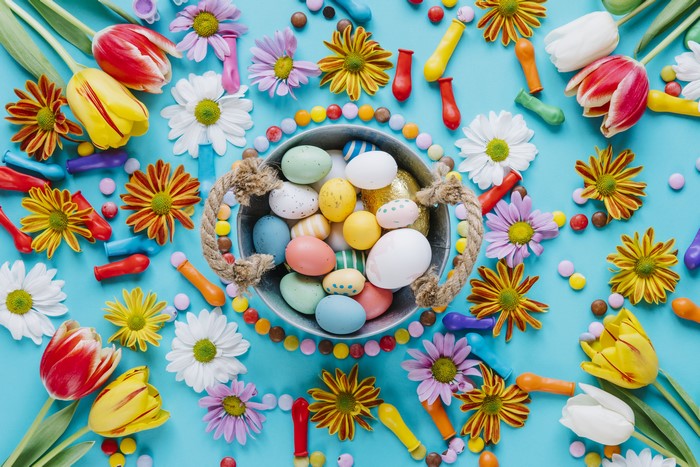 Easter eggs, tulips, and chrysanthemums with candy