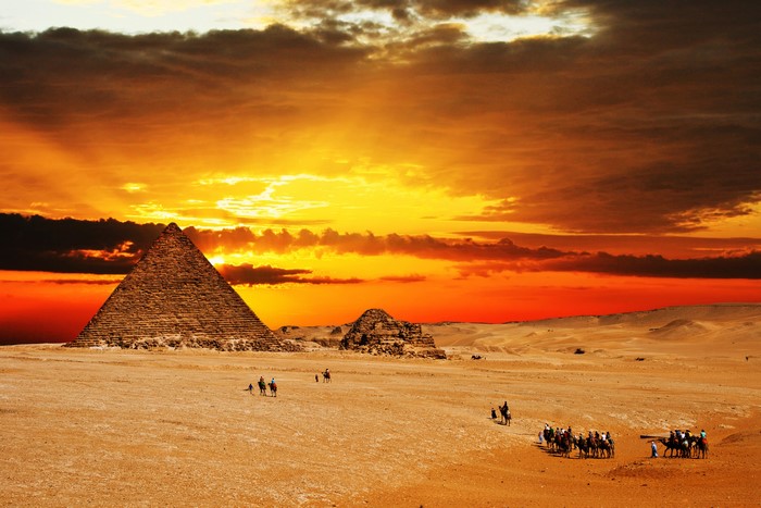Pyramids in Egypt at Sunset with Camels