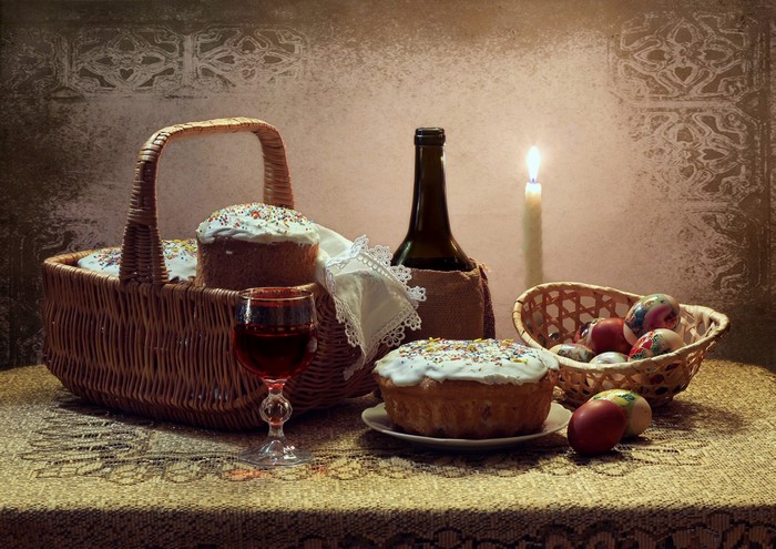Easter still life with kulich, eggs, wine, and candle