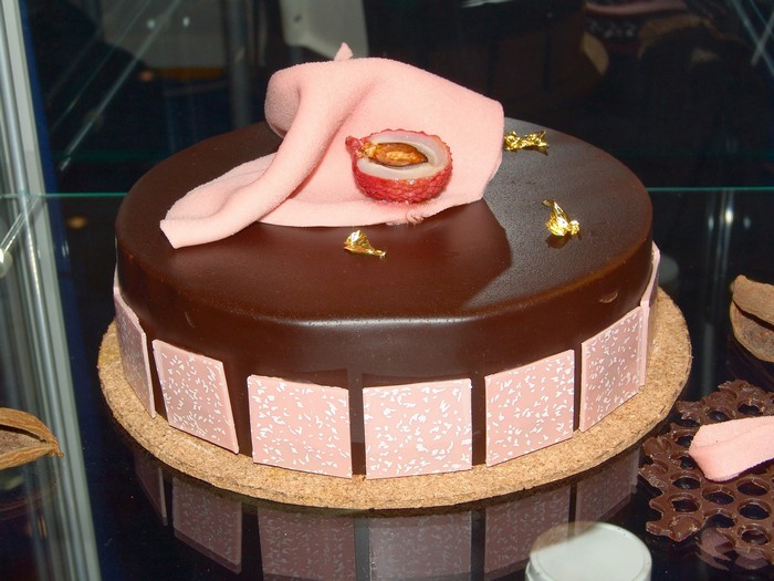 Chocolate cake with pink fondant and lychee
