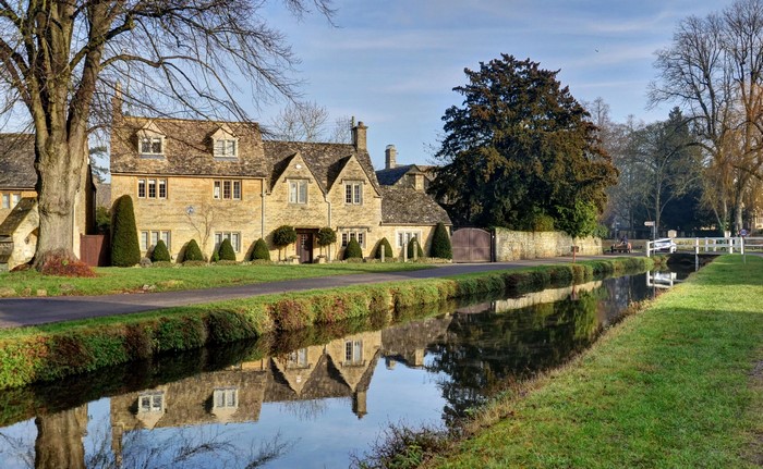 Houses along a canal in Lower Slaughter, Cotswolds, United Kingdom