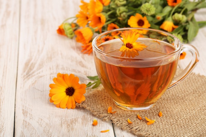 Cup of Tea with Calendula Flowers