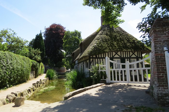 Thatched roof house by a stream in Veules les Roses, France
