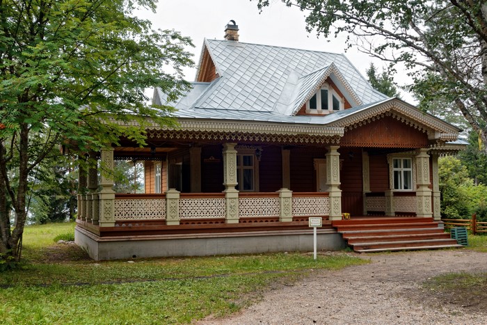 Wooden house with ornate porch in Mandrogi, Leningrad Oblast, Russia