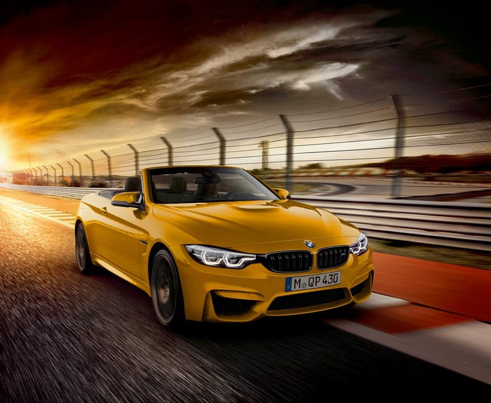 Yellow BMW M4 Cabriolet 30 Jahre Edition on Race Track