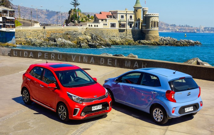 Two Kia Picanto cars by the sea