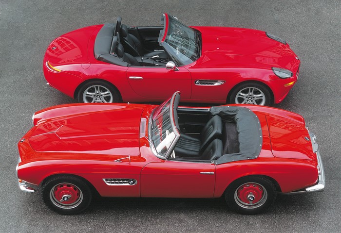 Two red BMW convertible cars