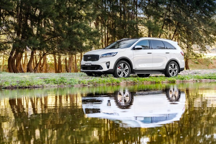 White Kia Sorento GT parked by a lake