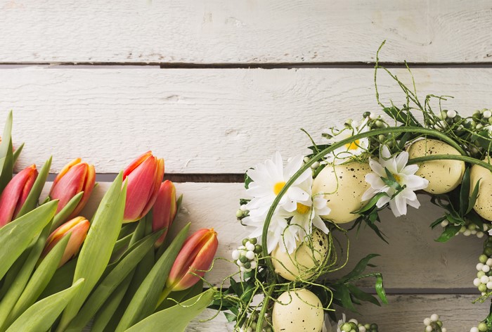 Easter wreath with tulips on wood planks