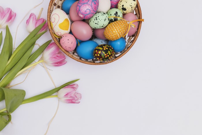Easter Eggs in a Basket with Pink Tulips