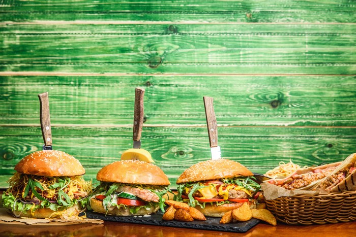 Hamburgers with knives and fries