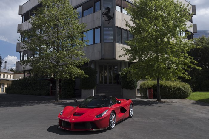 Red Ferrari LaFerrari Prototipo in front of Ferrari building