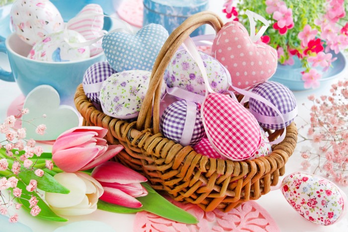 Easter eggs and tulips in a wicker basket
