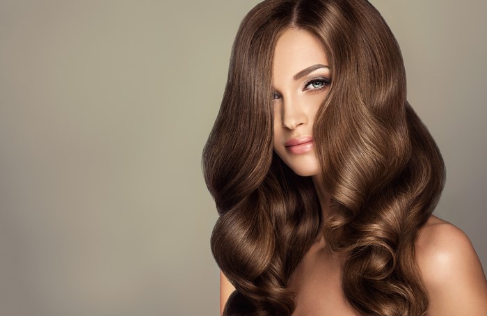 Woman with long wavy brown hair