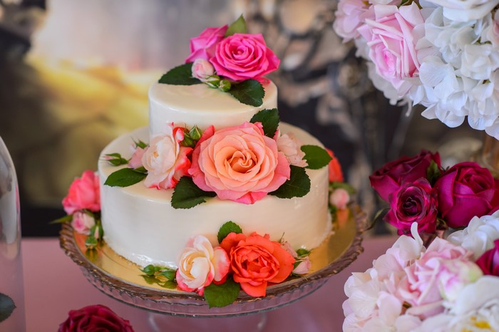 Two-tiered cake decorated with roses