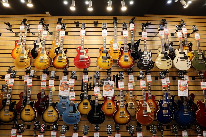 Wall of electric guitars in a store