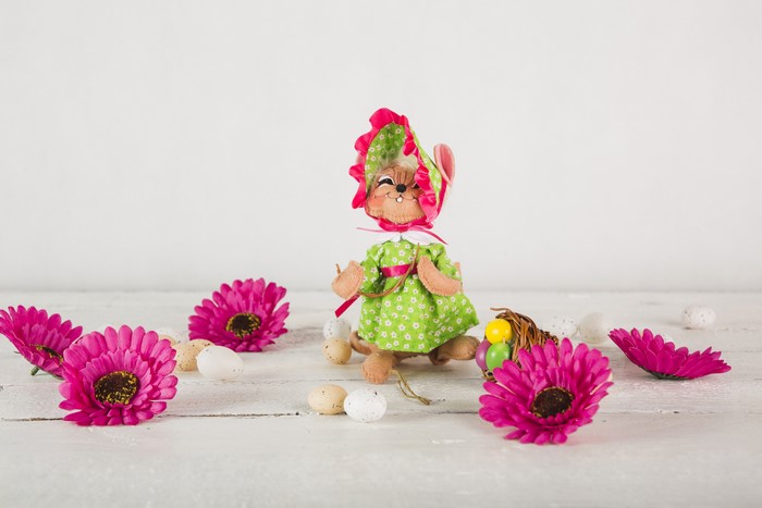 Easter bunny with flowers and eggs