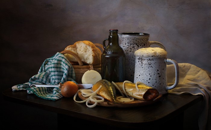 Still life with fish, bread, beer, and onions