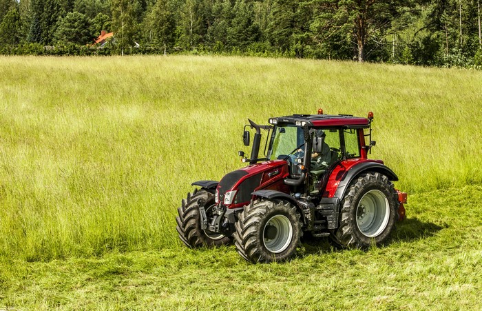 Red Valtra N Series tractor in a field
