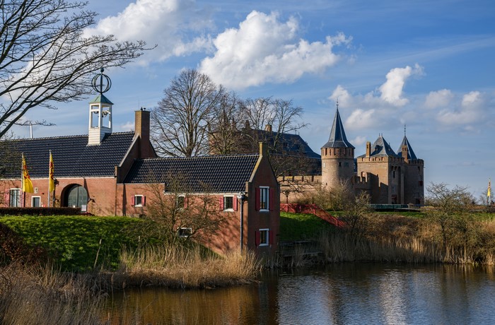 Castle Muiden and houses by a pond in the Netherlands