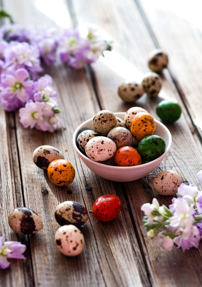 Easter Eggs and Purple Flowers on Wood