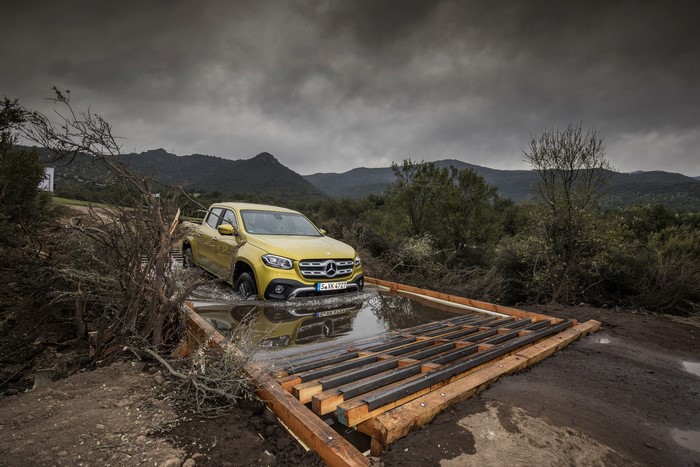 Yellow Mercedes-Benz X-Class Pickup driving through water