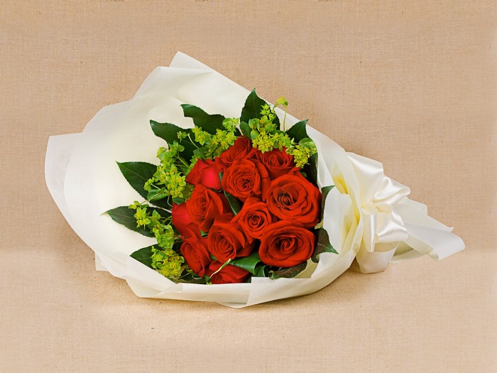 Bouquet of red roses with green accents