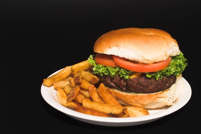 Hamburger and French fries on a plate