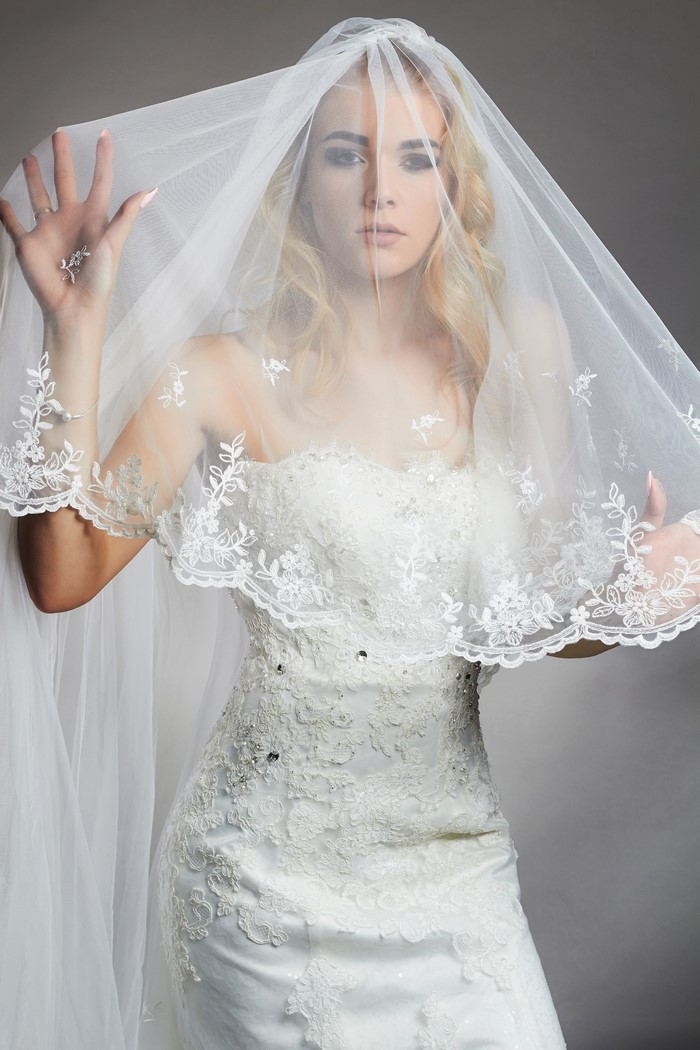 Bride in a white wedding dress and veil