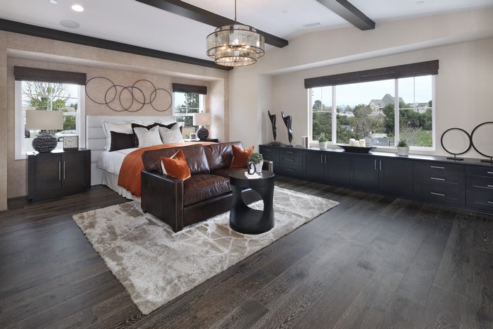 Bedroom with Bed, Chandelier, and Armchair