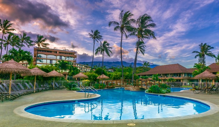 Resort pool with palm trees and buildings in Maui, Hawaii