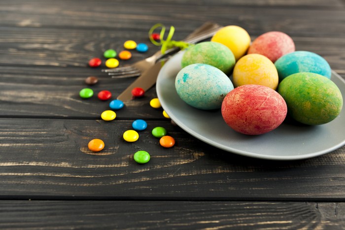 Easter Eggs and Candy on Wooden Table
