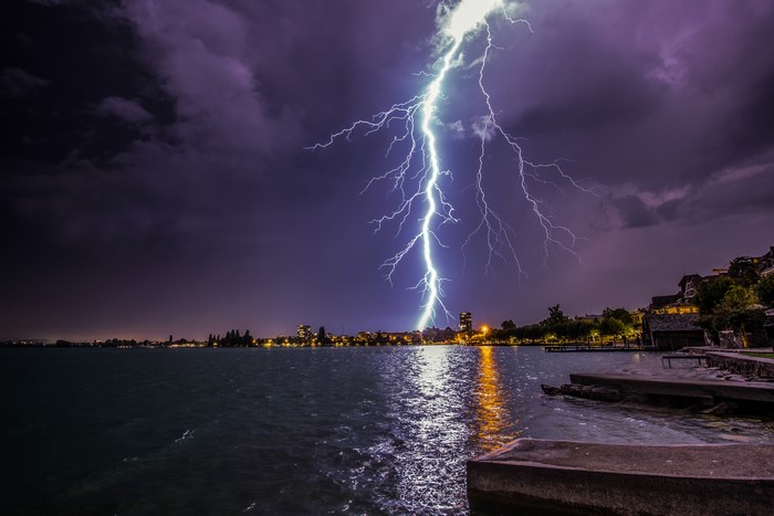 Lightning strike over Lake Zug at night